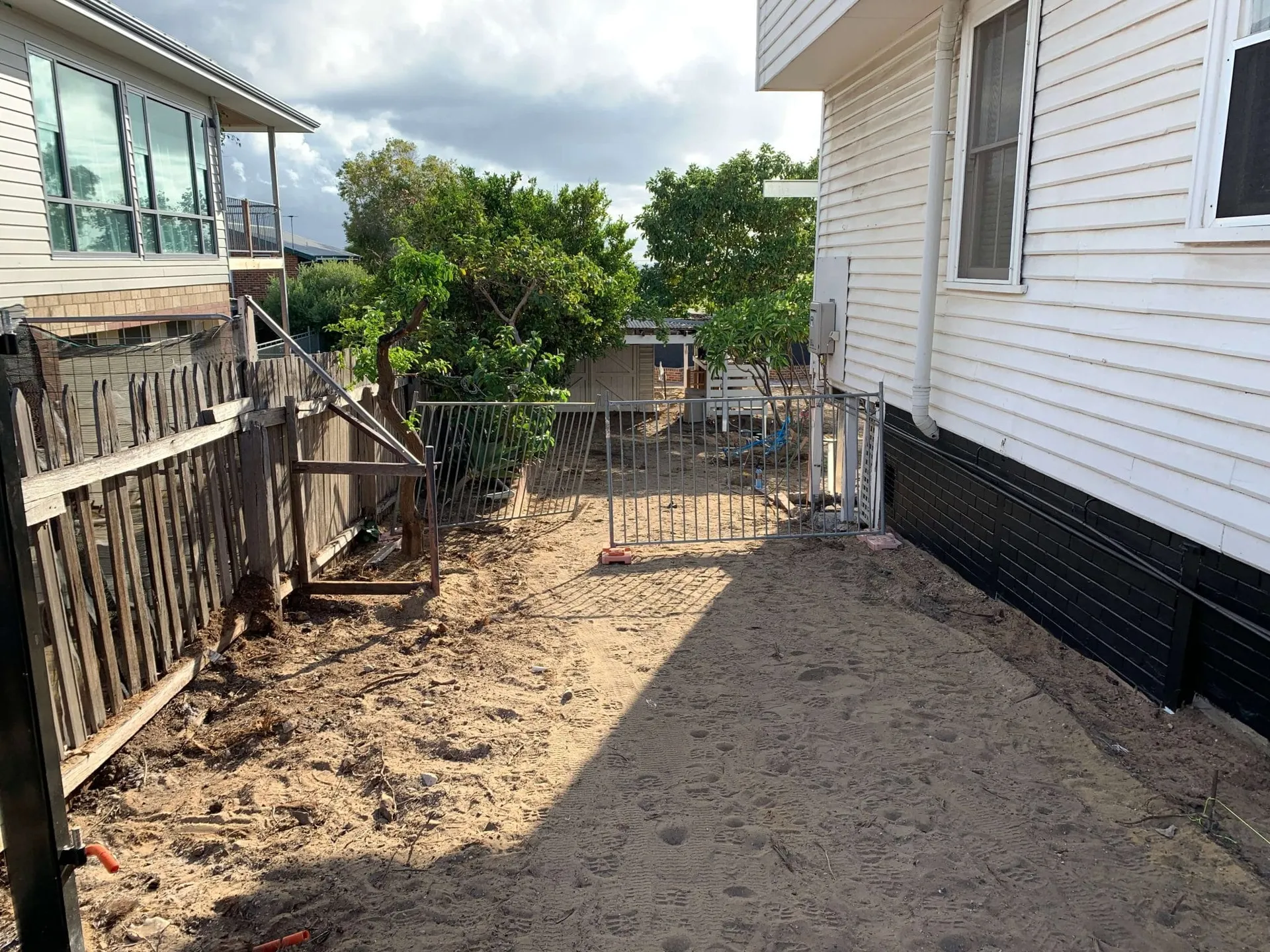 Existing Beaconsfield backyard in Perth before site prep, showing the overgrown layout to be replaced.