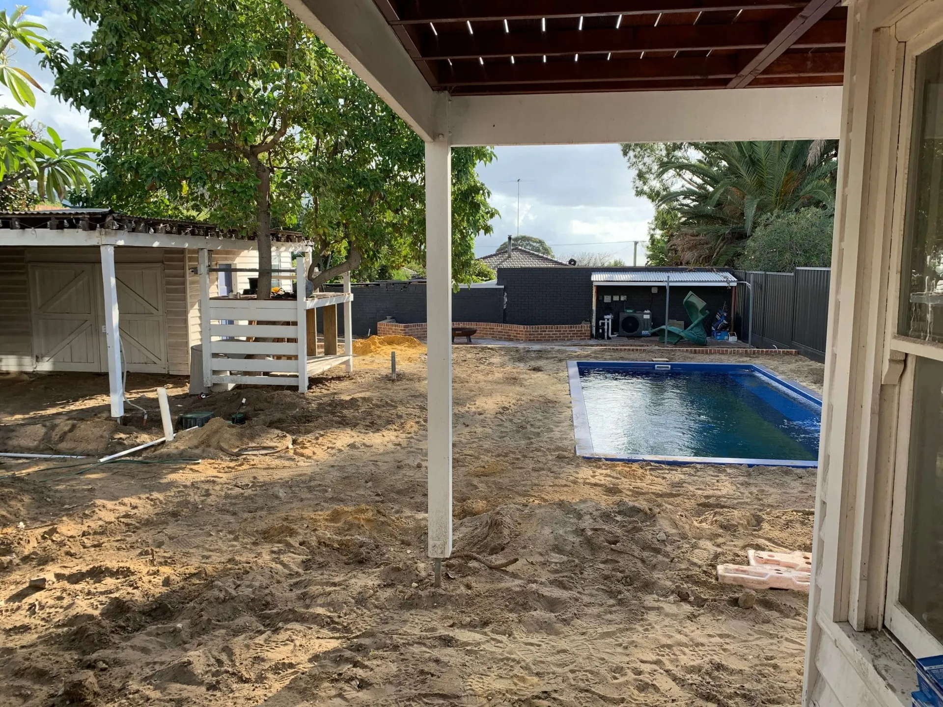 Site prep groundwork at the Beaconsfield Perth project with reshaped soil and new drainage runs.
