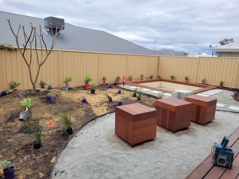 Planting and landscape construction in progress at the Beeliar Perth backyard design project.