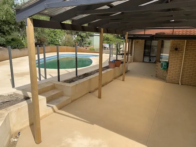 Fresh concrete being poured for the new entertaining area during the Leeming Perth landscape build.