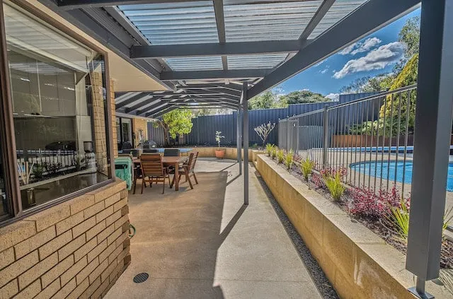 Modern entertaining area with new concrete and limestone walls at the Leeming Perth backyard.