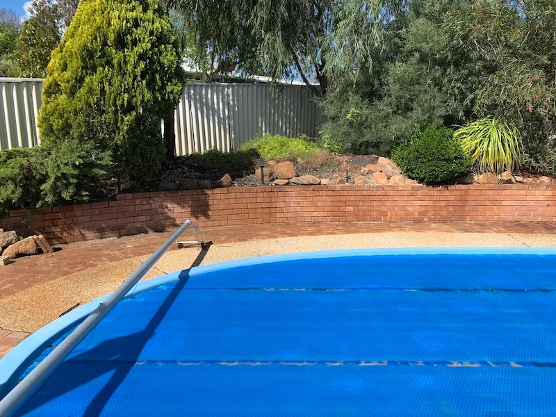 Dated brick-style pool surround in the Leeming Perth backyard before the modern landscape upgrade.