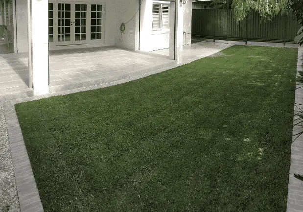 New buffalo lawn installed in a Perth back garden with mulched borders