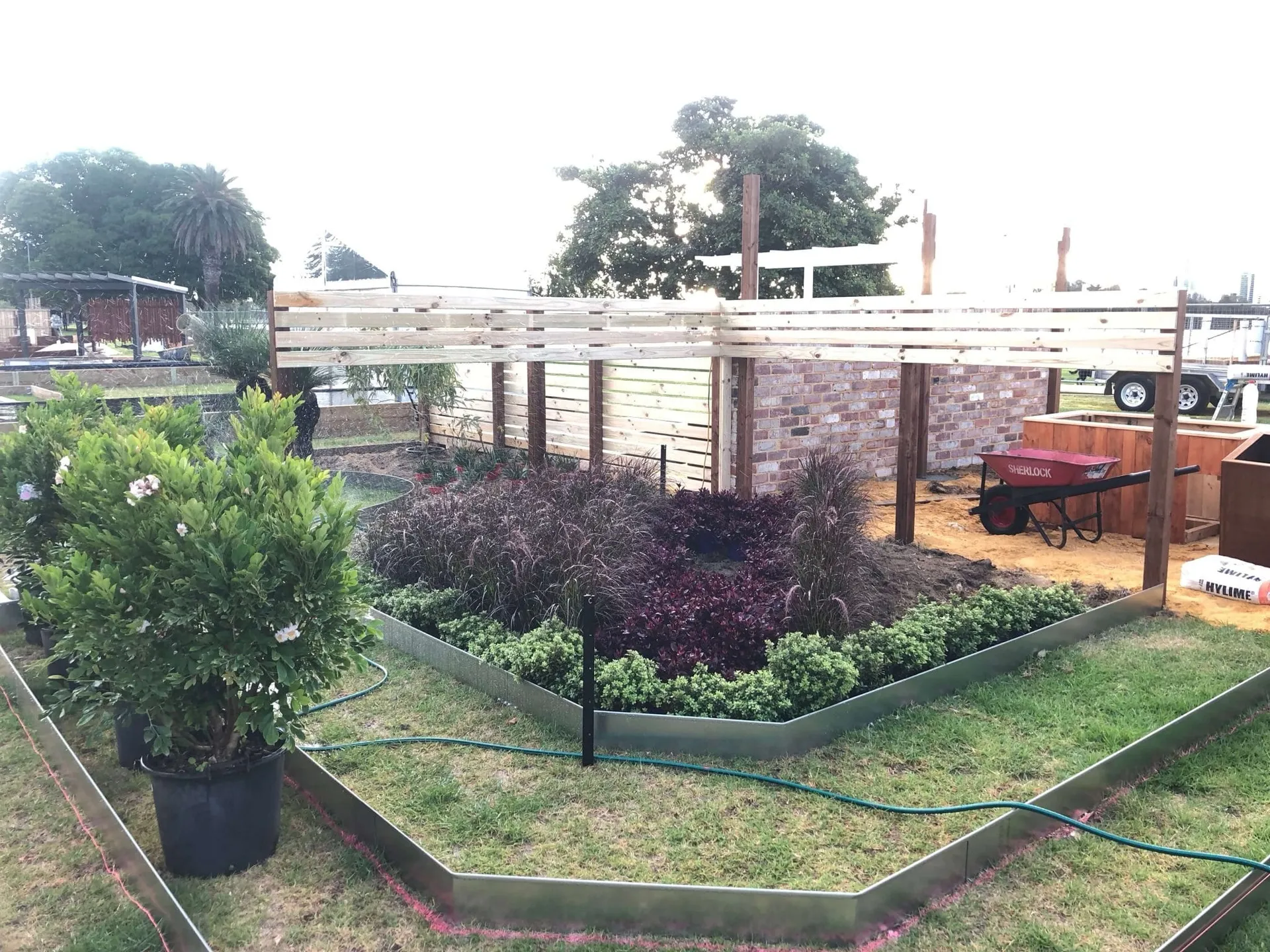 Wide landscape view of the completed Perth Garden Show four-garden display by the Swan River.