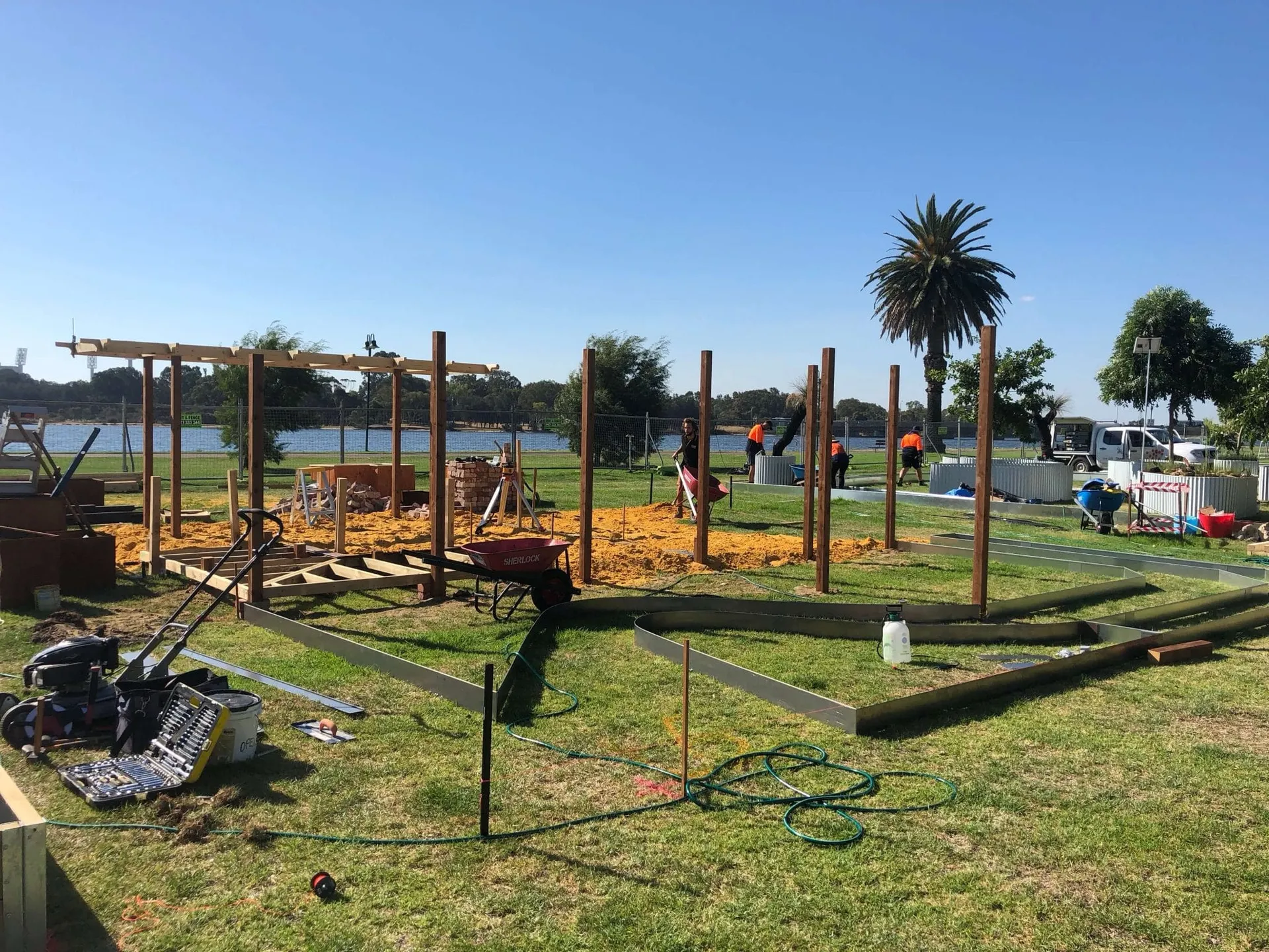Crew staking ground and marking out the Perth Garden Show display zones before build.